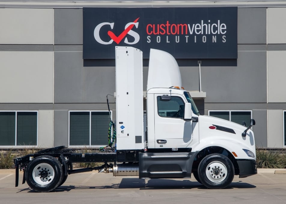 Peterbilt truck with Cummins Clean Fuel Technologies back of cab CNG fuel system