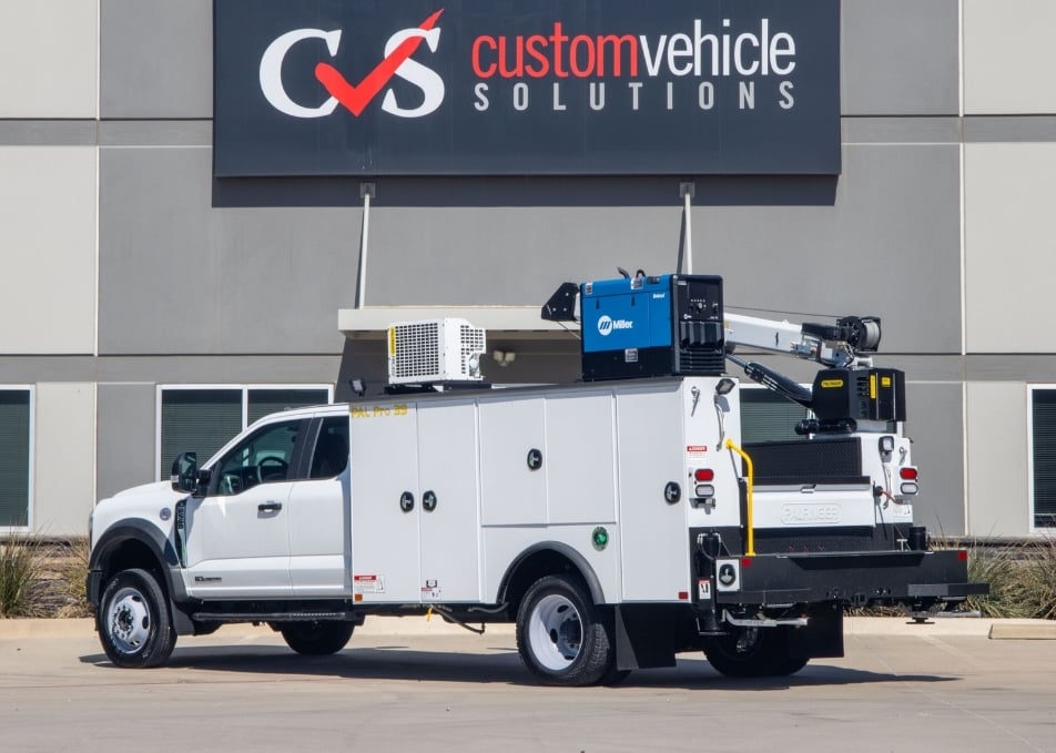 Back view of white Ford truck with Palfinger Pal Pro 39 service body with crane