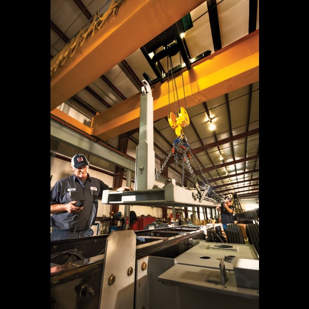 Techs installing truck body with hook lift