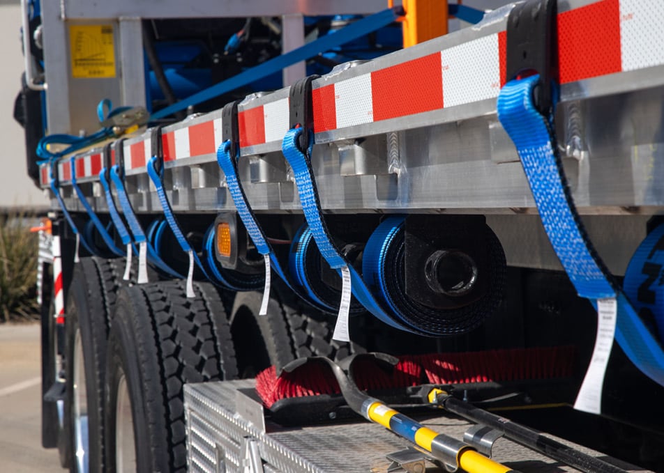 Cargo straps installed on flatbed truck body