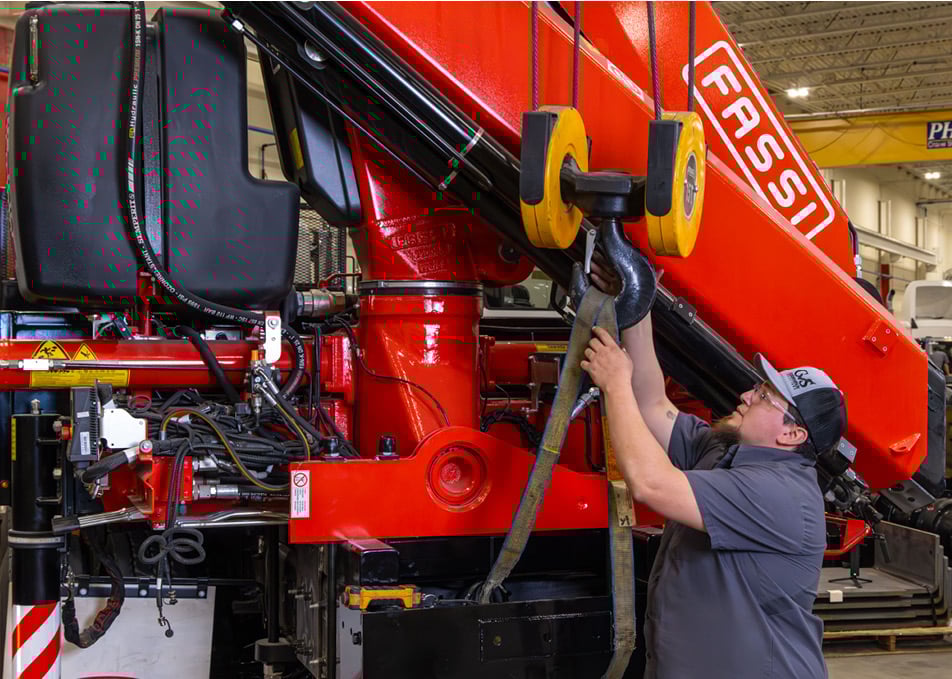 Technician working on Fassi knuckle boom crane