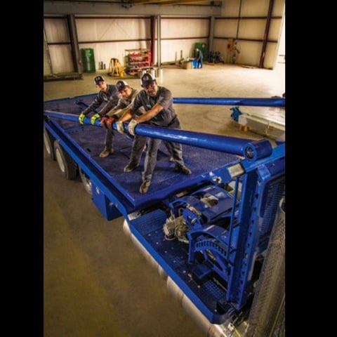 Three techs installing truck body