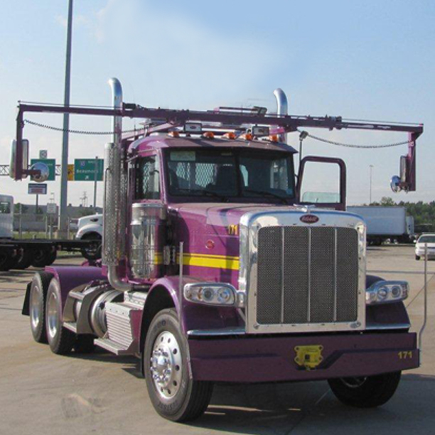 Front view of purple roll off truck