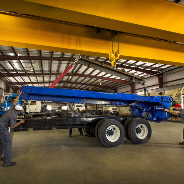 Techs installing truck body