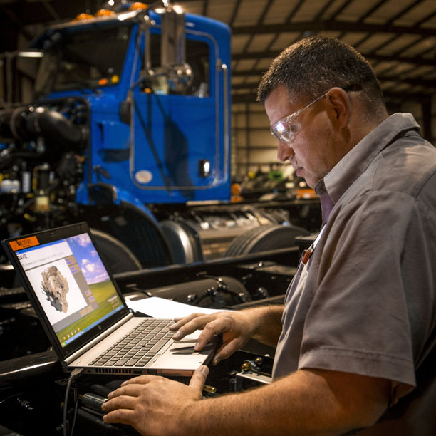 Technician performing pre-delivery inspection