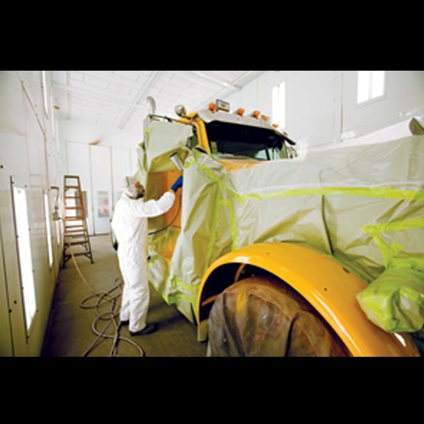 Tech painting truck in paint booth