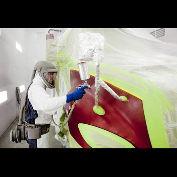 Tech painting truck in paint booth