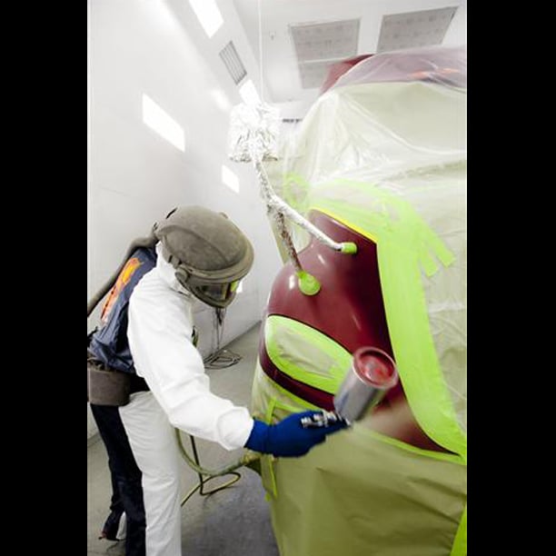Tech painting truck in paint booth