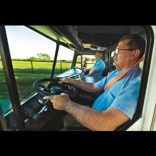 Refuse truck with dual steering wheels