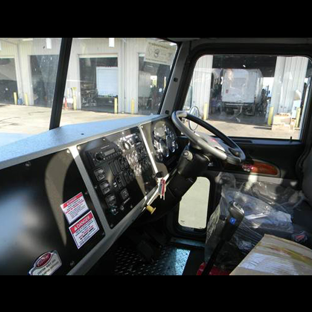 Second steering wheel added to refuse truck