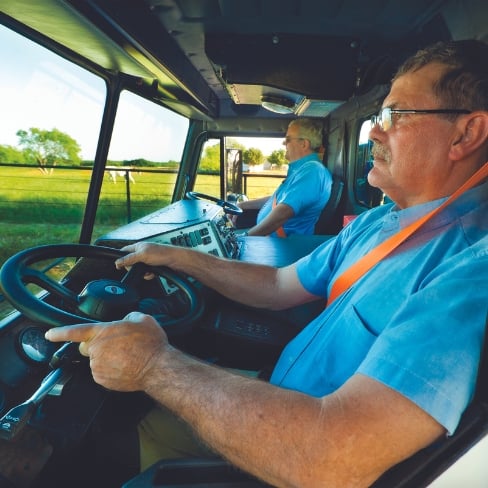 Refuse truck with dual steering wheels