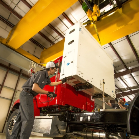 Tech installing CNG fuel system on truck