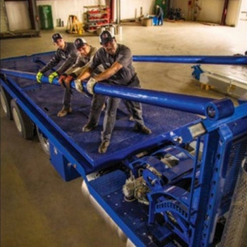 Three techs installing truck body