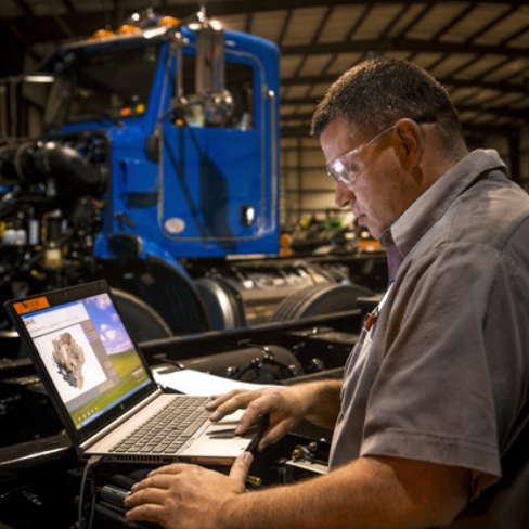 Tech performing pre-delivery inspection